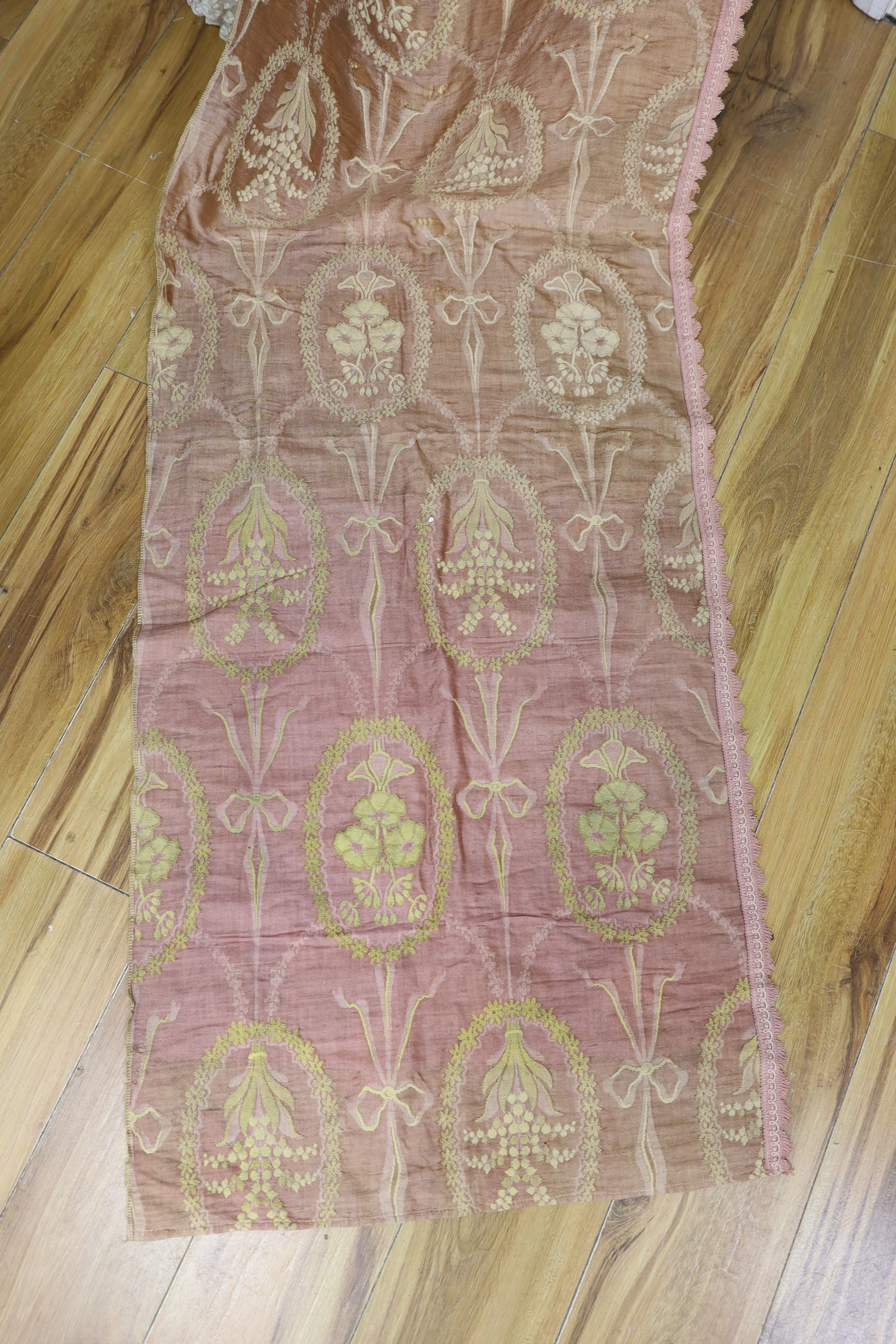 An unusual early 20th century hammock and pink brocade curtains